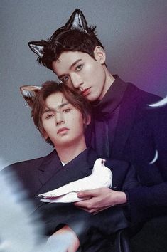 two young men with cat ears on their heads