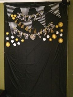 a black and white banner with gold decorations