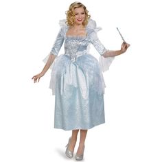 a woman in a blue dress holding a wand