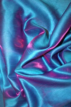 a blue and purple fabric with some folds