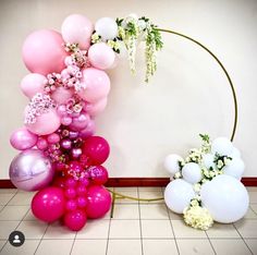 balloons and flowers are arranged on the floor