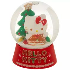 a hello kitty snow globe with christmas decorations