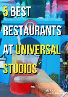 a person holding up a drink with the words 5 best restaurants at universal studios