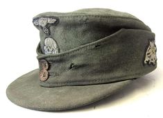 an army green hat with buttons on it