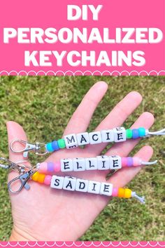 hand holding three personalized keychains with the words made from plastic letters on them