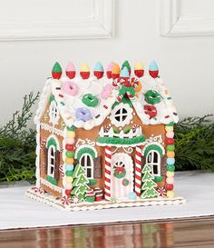 a gingerbread house decorated with candy and decorations