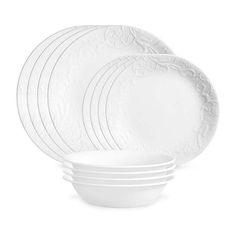 white dinner plates stacked on top of each other