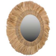 a mirror that is made out of straw and has fringes on the edge of it