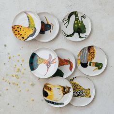 six plates with different designs on them