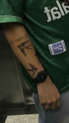 a man with a tattoo on his arm