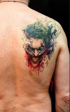 a man with a joker tattoo on his back