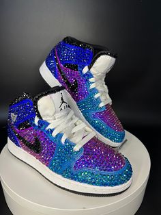 Step up your sneaker game with some fully blinged Jordan 1 mids. I have other versions of this listing up but these feature a BEAUTIFIL ombré pattern. These shoes are a great addition for prom, a birthday, a wedding, a night on the town, or your  next event! These shoes can be customized to the colors of your choosing. Not looking for Jordan 1's? Message me with your shoe choice. I'd love to create the custom shoe of your dreams. *Disclaimer We are not associated with the brand, I only hand customize the shoes using rhinestones. Rhinestone Nikes, Bedazzled Sneakers, Custom Jordan Shoes, Bedazzled Shoes Diy, Rhinestone Sneakers, Jordan 1 Mids, Cute Casual Shoes, Sneaker Ball, Casual Shoes Women Sneakers