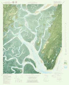 an aerial view of a river and land