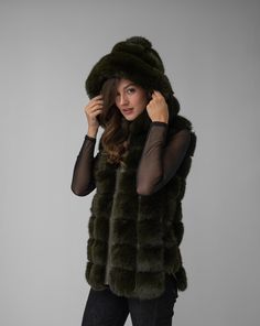 Introducing our Faux Fur Hooded Vest, a timeless and luxurious addition to any wardrobe. This elegant vest exudes sophistication and glamour, with its sumptuous faux fur and stylish design. Perfect for layering over any outfit, it's a versatile piece that seamlessly transitions from day to night. Elegant Vest, Hooded Vest, Jumpsuit Jacket, Day To Night, To Night, Fall Collections, Outerwear Coats, Sweater Skirt, Stylish Design