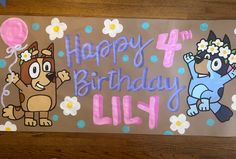 a birthday card with two cartoon dogs and flowers on the front, happy 4th birthday lily