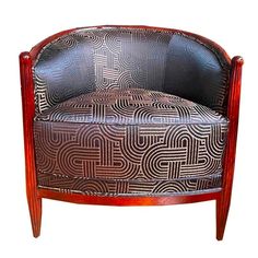 a chair that is sitting up against a white background with an intricate design on it