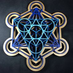 "This Metatron's Cube is made with 4 layers of 1/4\" birch plywood that is laser cut, hand painted, wood stained, glued then finished with a light clear coat. The color tone is Blue Fade with a Natural wood-stained base. Each piece is a labor of love. I take great pride in making these Metatron's Cube for you to enjoy. Many of these pieces find their way into homes, temples, shrines, altars, yoga and meditation spaces. There is a custom wooden hanger on the back of each piece for easy wall hangi Cube Wall Art, Yoga And Meditation Space, Mandala Inspiration, Geometry Mandala, Sacred Geometry Mandala, Natural Stain Wood, Metatron's Cube, Chakra Art, Metatrons Cube