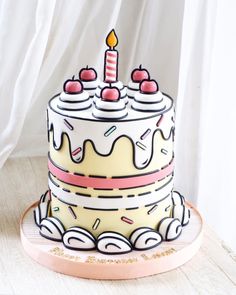 a birthday cake decorated with candles and sprinkles