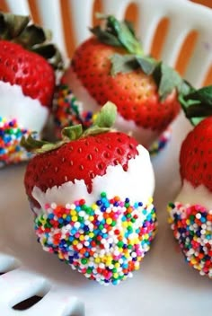 there are many strawberries with sprinkles on them