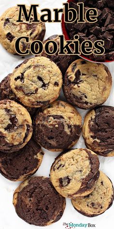 chocolate chip cookies are stacked on top of each other with the words marble cookies above them