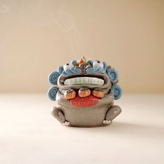 "The inspiration for this design comes from \"Little Beard\", which is cute and playful.There is a row of neat and white teeth. Our Ceramic Incense Holder, graced with the mystique of the Pixiu, is not just an incense holder. Pixiu is a divine beast in Eastern culture, presenting mysterious Eastern culture in a cute way,Its versatile design also makes it a perfect tea pet, enriching your tea rituals with an added layer of cultural charm. As a desk ornament, it brings a tranquil yet powerful presence to your workspace or home, embodying both protection and prosperity.  It's perfect for: - **Chinese New Year Embracing the spirit of prosperity and good fortune. - **Christmas As a unique and culturally rich present. - **Birthdays Offering a personal touch of tranquility and good luck. - **Hous Incense Waterfall, Divine Beast, Insence Burner, Desk Ornament, Eastern Culture, Meditation Accessories, Ceramic Incense Holder, Ceramic Incense, Tea Pet