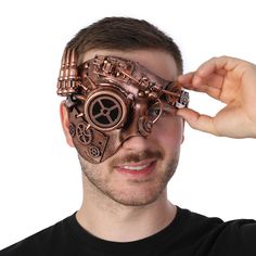 Introducing our exquisite Steampunk Half Face Mask in a stunning bronze finish! This unique accessory is the perfect blend of vintage charm and futuristic style, making it a must-have for any steampunk enthusiast or costume party-goer. Crafted with meticulous attention to detail, this mask is designed to captivate and transport you to a world of Victorian elegance and industrial innovation. The bronze colour of this mask adds a touch of opulence and sophistication, while the intricate gears and Steampunk Man, Steampunk Aesthetic, Mascaras Halloween, Steampunk Mask, Steampunk Cosplay, Half Face Mask, Futuristic Style, Halloween Fancy Dress, Rustic Art