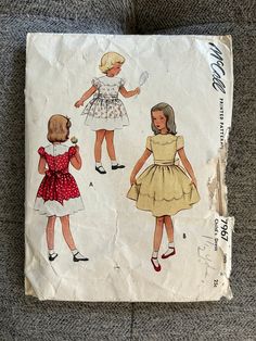 "Vintage Sewing Pattern McCall's 7967 ca. 1950's Toddler girls' short sleeved dress. Size 2, breast 21\". Pattern has been cut out, but is complete. Envelope has wear. From a smoke-free home." Vintage Baby Dress Patterns Free, 1950 Kid Dress Pattern, Vintage Sewing Patterns Children, 50s Patterns, Short Puffy Sleeves, Teddy Girls 1950s, Vintage Sewing Patterns 1970s Children, Sewing Vintage, 1950 Fashion