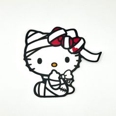 a hello kitty sticker with a red bow on it's head and eyes