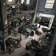 an old factory filled with lots of tables and chairs