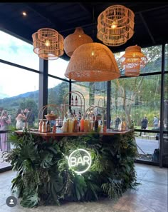 the bar is decorated with plants and lights