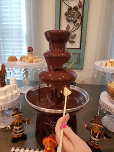 a chocolate fountain is being used as a centerpiece