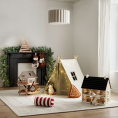 a living room filled with furniture and christmas decorations