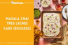 masala cha tres leches cake eggless on a table with flowers and plates