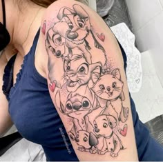 a woman with a tattoo on her arm that has many cartoon characters all over it