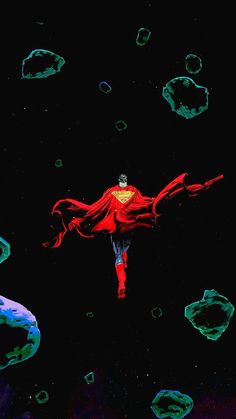 a man flying through the air while wearing a red cape