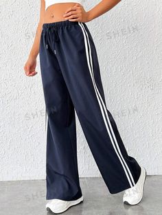 Style:Casual \nClosure Type:Drawstring Waist \nDetails:Knot \nDetails:Side Stripe \nColor:Navy Blue \nPattern Type:Striped \nType:Wide Leg \nWaist Line:Drop Waist \nLength:Long \nFit Type:Loose \nFabric:Non-Stretch \nMaterial:Woven Fabric \nComposition:100% Polyester \nCare Instructions:Hand wash or professional dry clean \nTemperature:Spring/Fall (18-25℃/63-77℉) \nBody:Unlined \nSheer:No \n Women Sweatpants, Traje Casual, Women Pants, Side Stripe, Drop Waist, Athletic Wear, Womens Sweatpants, Wide Leg Trousers, Fashion Online Shop