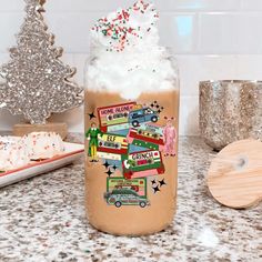 a glass jar filled with whipped cream and toppings on top of a kitchen counter