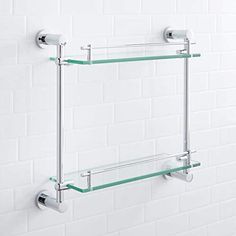 two glass shelves mounted to the wall