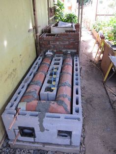 an outdoor area with cement and bricks in it