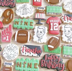 decorated cookies are arranged in the shape of footballs and other sports related items on a table