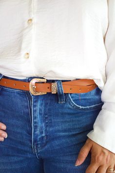 Elevate your style with our Var Buckle Belt! This versatile accessory features a unique var buckle that adds a touch of elegance to any outfit. Made from high-quality materials, it's not only fashionable but also durable. Upgrade your wardrobe and make a statement with our Var Buckle Belt. Trendy Brown Belts With Buckle Closure, Trendy Brown Belt With Buckle Closure, Chic Brown Belt With Buckle Closure, Adjustable Belt With Buckle Closure For Fall, Trendy Belt Buckles For Fall, Chic Adjustable Belt With Gold Buckle, Trendy Gold Belt Buckles With Matching Belt, Trendy Gold Belts For Fall, Trendy Gold Belt For Fall