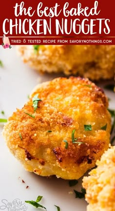 the best baked chicken nuggets recipe on a white plate with parsley sprigs