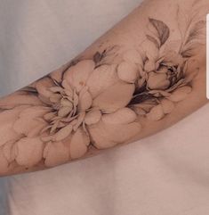 a person with a flower tattoo on their arm