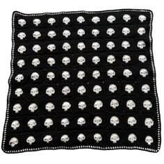 a black and white blanket with skulls on it