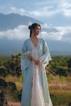 Our newest Linen Kimono, has become already a bestseller in our show room and now available for you. This stunning outfit features a linen kimono and a belt that can be worn alone or as an extra layer with most of our dresses. With the help of the belt you can turn this kimono cardigan into a kimono dress. Crafted in Bali, this elegant kimono is completely made of organic linen that has anti-microbial and hypoallergenic properties, making it perfect for the body, adding grace and style to your u Sky Blue Cardigan, Long Jacket Women, Cardigan With Belt, Red Boho Dress, Boho Womens Clothing, Elegant Kimono, Linen Kimono, Bohemian Kimono, Linen Cardigan