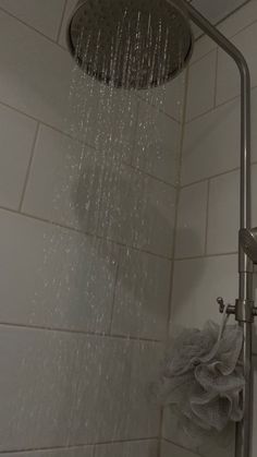 a shower head with water running down it