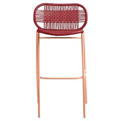 a red bar stool with wooden legs and a woven seat pad on the backrest