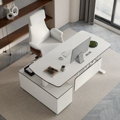 an office desk with a laptop on it