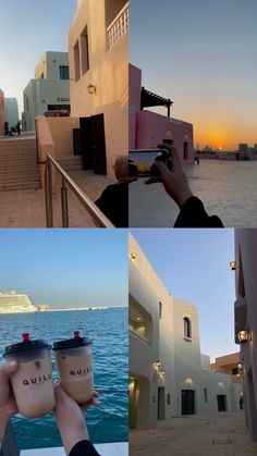 a person taking pictures of some buildings and water