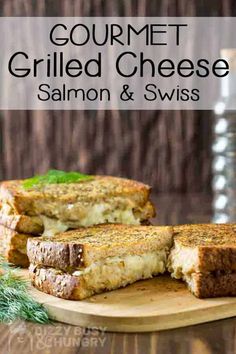 two grilled cheese sandwiches on a cutting board with the words gourmet grilled cheese salmon and swiss